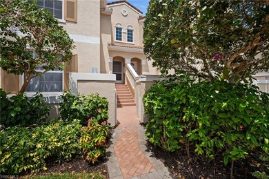 Property entrance with a tiled roof and stucco sid