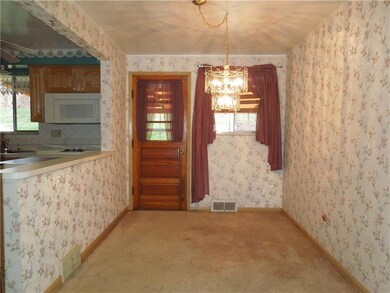 Inviting Dining Room.  Back door leads to covered 