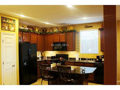 Property Photo. Tall kitchen Cabinetry with lighti
