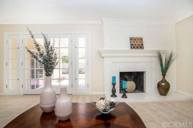 The fireplace, with marble surround and custom woo