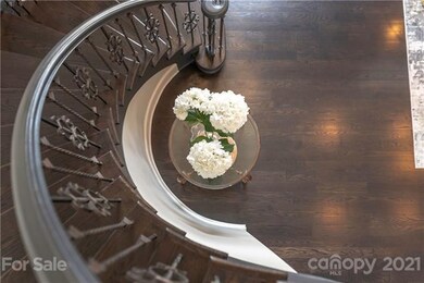 Iron railings set off this sweeping main staircase