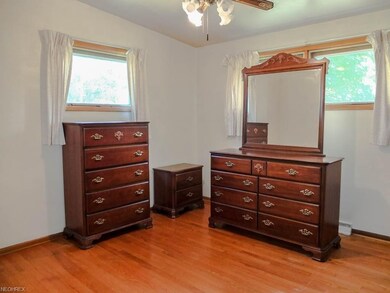 Bedroom 1 with wood flooring.