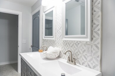 View of Primary Bathroom from other side of room showing the Closet. 