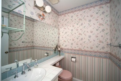 A Half bathroom and laundry room are right off the