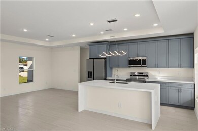 Kitchen with sink, appliances with stainless steel