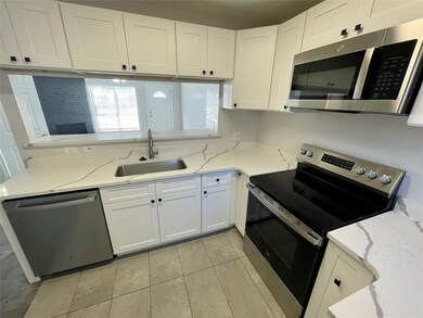 Kitchen featuring appliances with stainless steel 