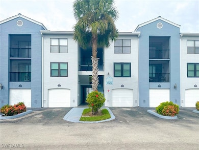 View of front facade featuring stucco siding and a balcony