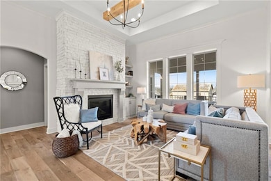 Great Room with gas fireplace - Photo from a previous model.