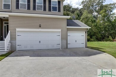 private wooded lot, 2 car garage PLUS golf cart ga
