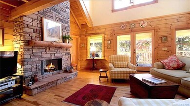 Living room opens to porch and deck.