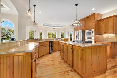 Custom hickory cabinets and floors throughout the home.