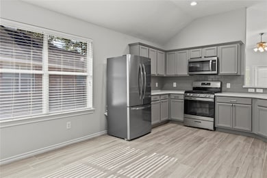 Four burner gas stove with grill plate