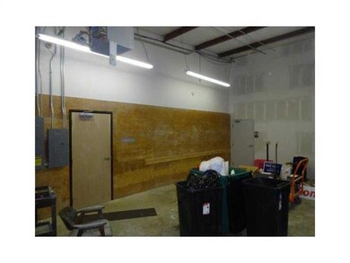 Warehouse. Warehouse doors to office and open room