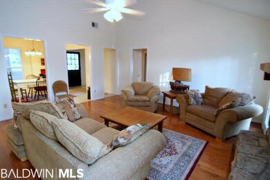 Spacious room with wood floors and fireplace. 16x1