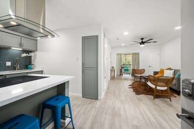 [Kitchen alternate view] The bar area offers seati