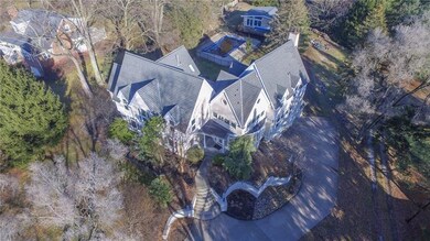 DRONE SHOT SHOWING POOL HOUSE IN THE REAR