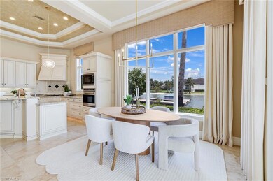 Dining space with a high ceiling, a tray ceiling, 