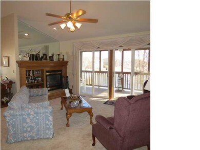 LIVING ROOM AREA WITH GAS FIREPLACE AND WALK OUT T