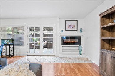 Enjoy the Ambience created by the Electric fireplace and French doors to the patio which can be seen from the living room and the dining area.