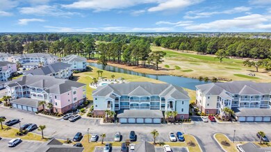 Aerial view featuring view of golf course, a resid