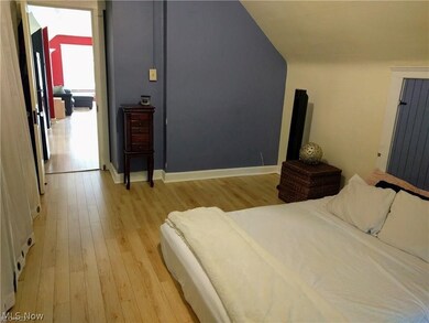 Bedroom with light hardwood / wood-style floors