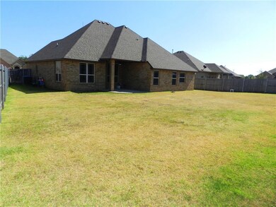 Exterior Back - Showing extra large backyard and c