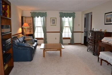 Formal living room with new carpet and chair rail,