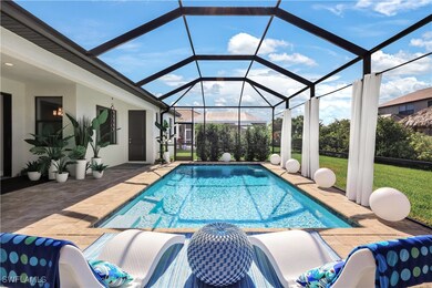View of swimming pool featuring a lanai, a yard, a