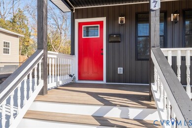 Property entrance featuring board and batten siding