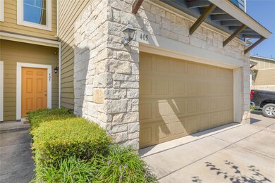 Garage featuring concrete driveway