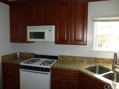 Very inviting Kitchen. Cherry Cabinets. Granite co