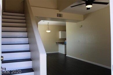 Stairway featuring visible vents, baseboards, wood