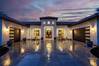 View of front facade featuring a garage, a tiled 