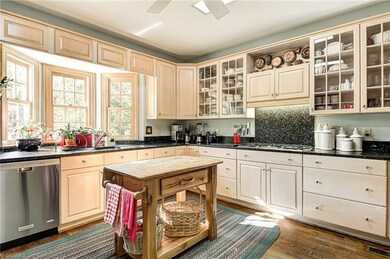Kitchen with gas stove and hardwood floors