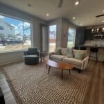 Living room with recessed lighting and wood finish