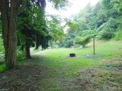 There is a small cleared field on one side of the 