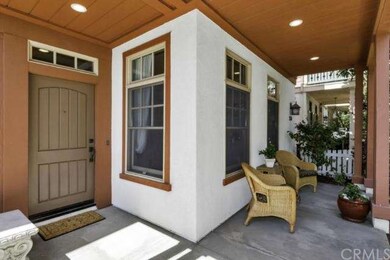 Front entry with a covered patio and a larger open