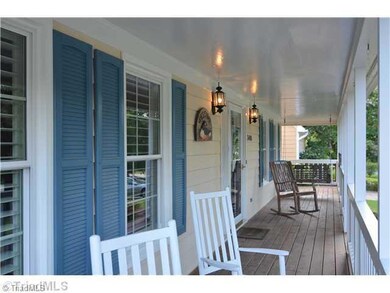 Exterior Front. Sit back and relax for a moment.  This beautiful covered rocking porch goes along the front and down the right side of this incredible home.