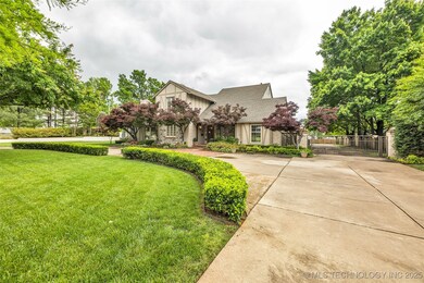English style home with a gate
