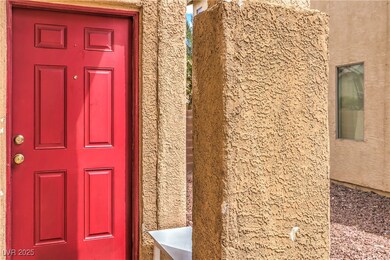 Entrance to property with stucco siding