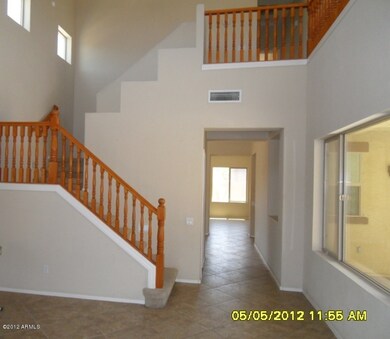 LIVING ROOM AND STAIRWAY