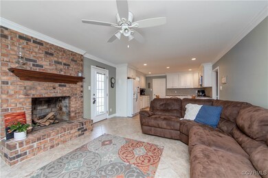 Spacious Family Room with Brick Fireplace and Tile