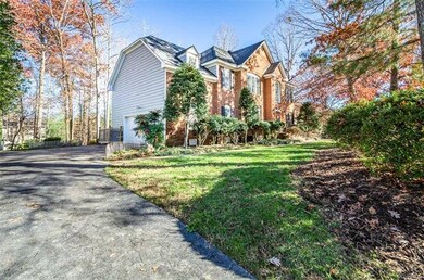 Double width paved driveway with 2-car side entry 