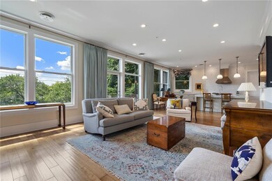 Light filled living room open to the kitchen