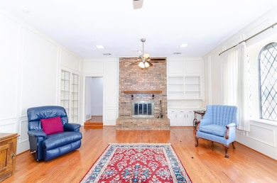 Living area featuring a decorative wall, built in 