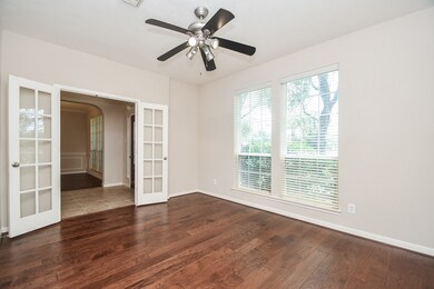 This room features hardwood floors, large windows