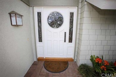 This home features a custom entry door with leaded