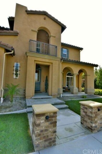Front entry with balcony above, spanish styling. 