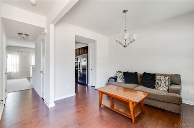 Living room with dark hardwood / wood-style floors