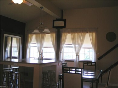 Eat in Kitchen has a large prep island, ceramic fl